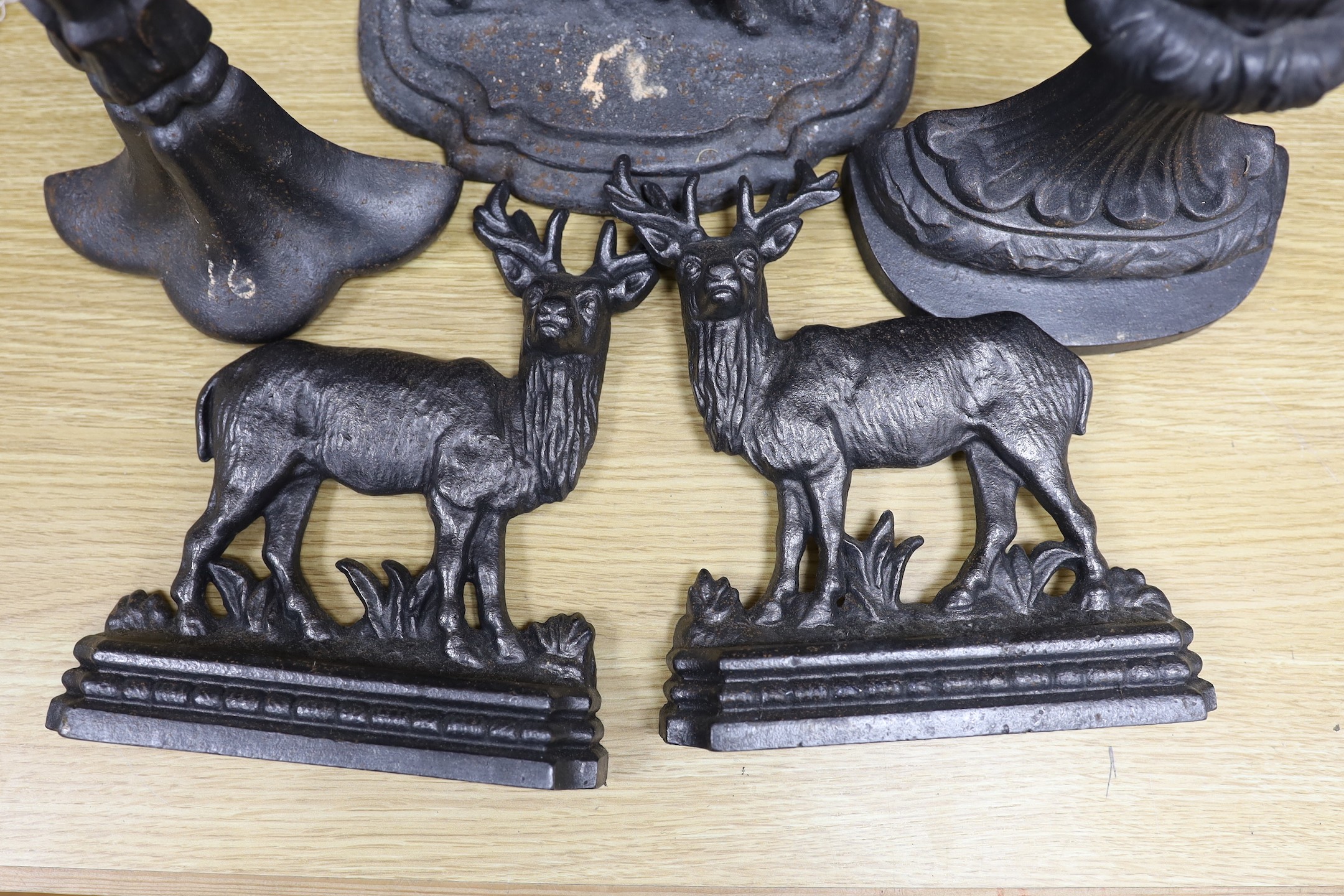 5 cast iron door stops, three of deer, tallest 39.5 cms high